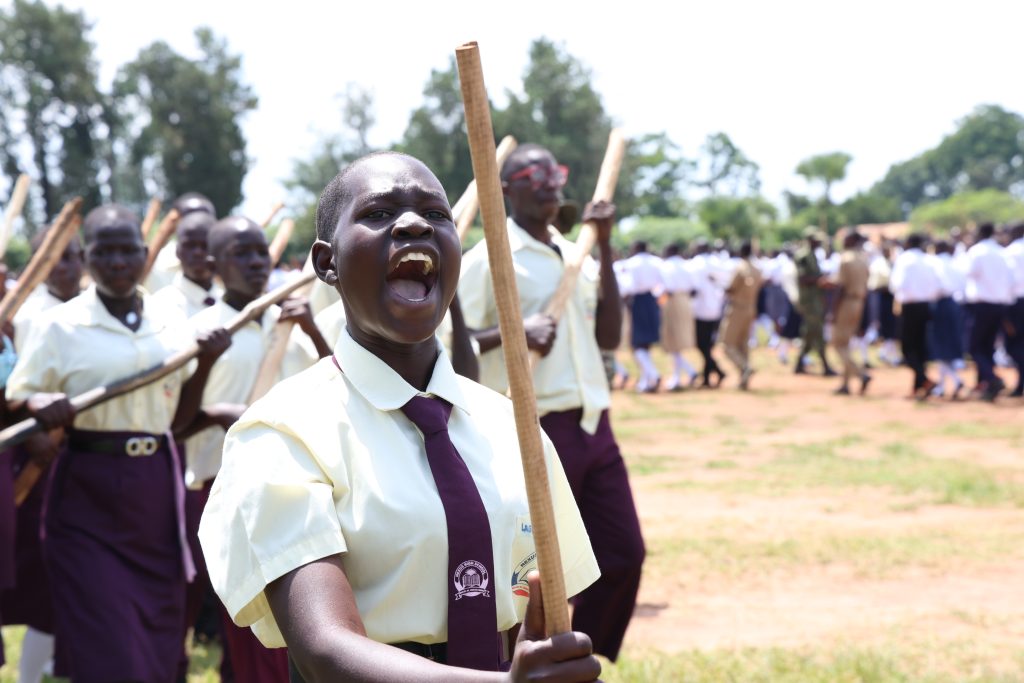 Patriot leads a parade at Lango College Play ground