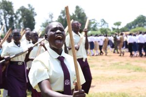 Patriot leads a parade at Lango College Play ground